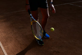 man with tennis racket